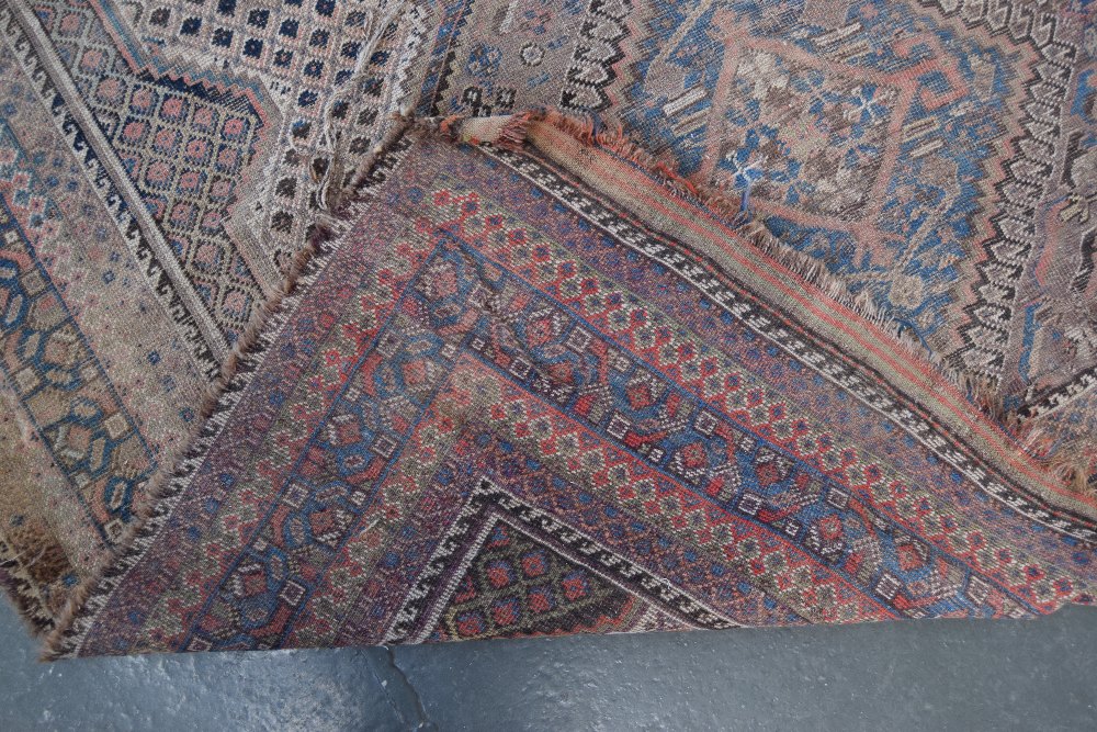 A Caucasian rug with red fields and three central lozenges and geometric borders 170 x 250cm - Image 2 of 2