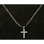 A 9ct gold chain with an eleven zirconia cross