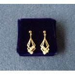 A pair of gold plated drop down earring with four small zirconia each