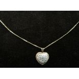 A 9ct gold chain with a heart shaped pendant paved with zirconia