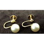 A pair of 9ct gold screw bead earrings each with single pearls