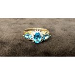 Two 9ct dress rings with blue stones and zirconia (one stone missing)