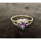 A 9ct gold ring with a heart shape mounted pink stone