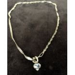 A 9ct Singapore ankle chain with a heart shaped stone pendant