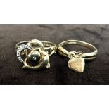 Two 9ct rings one with a heart charm the other with a dolphin and zirconia