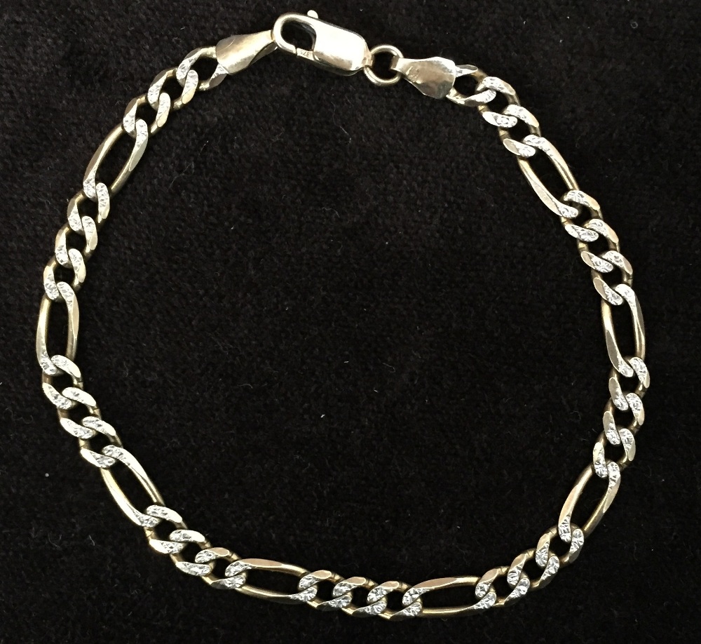 A 9ct gold Figarucci chain bracelet with white metal engraved decorations