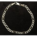 A 9ct gold Figarucci chain bracelet with white metal engraved decorations