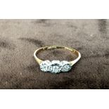 A 9ct gold ring with three zirconia (af)