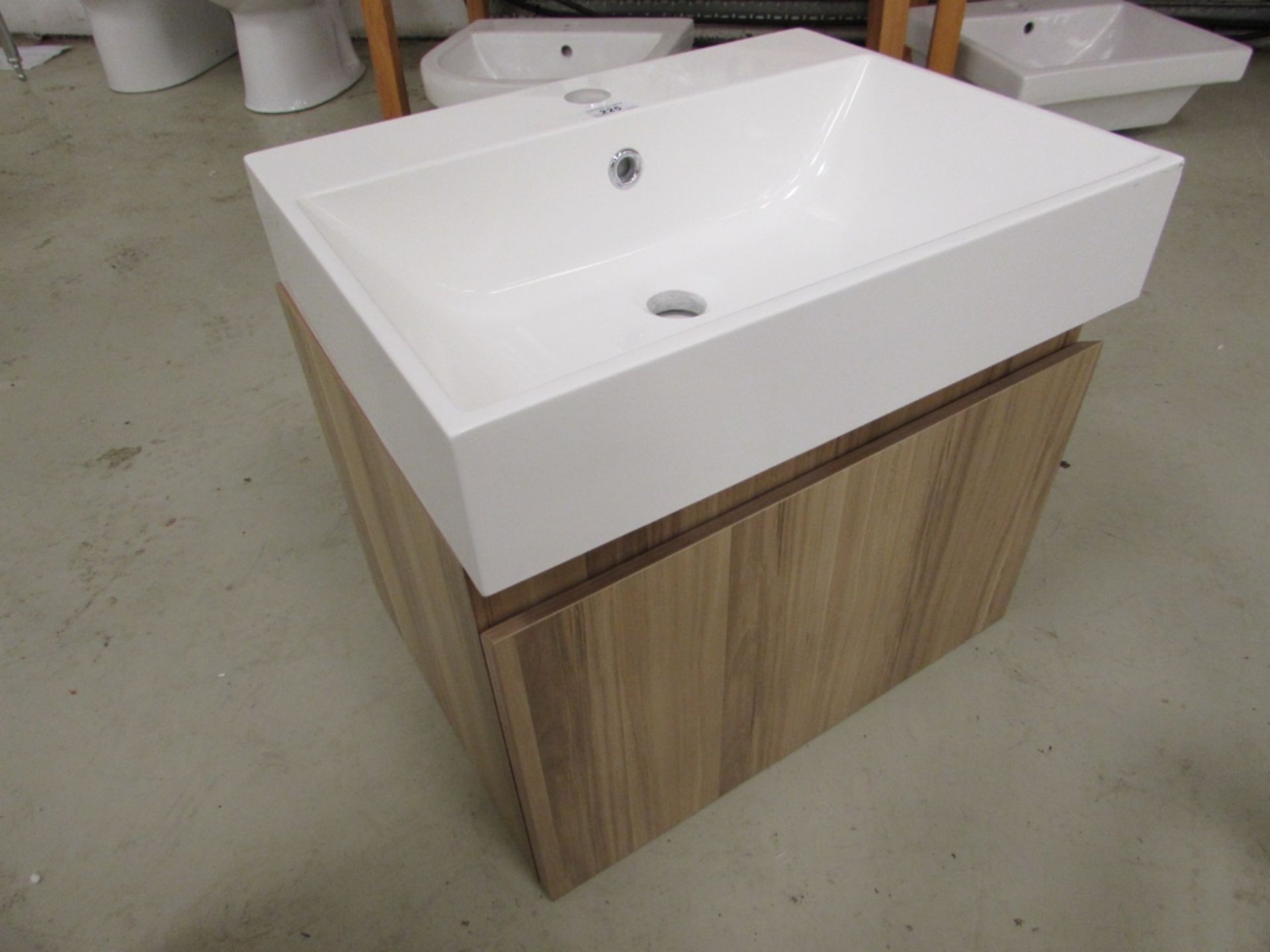 Compact 500mmwide wall hung vanity unit with resin basin and soft close draw in light oak finish