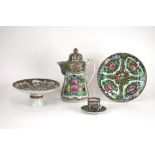 An extensive Cantonese polychrome service, 20th Century, compartmentalised decoration with flowers,