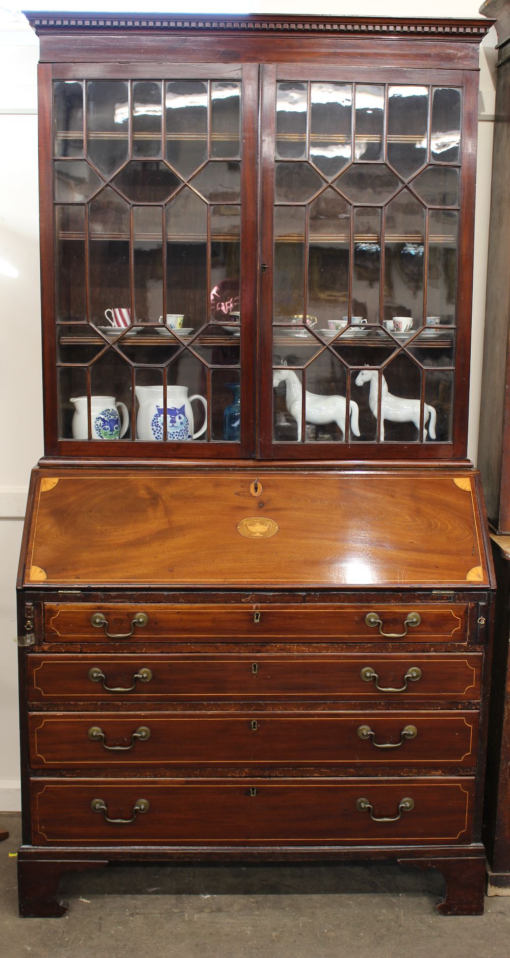 An Edwardian inlaid mahogany bureau bookcase, moulded cornice plain frieze,