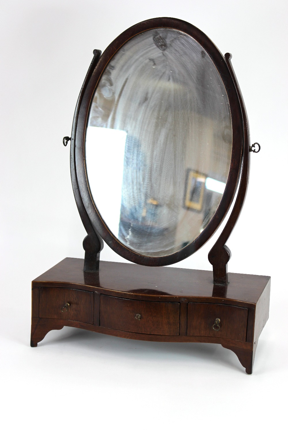 A Victorian mahogany toilet mirror, oval plate, slender uprights,