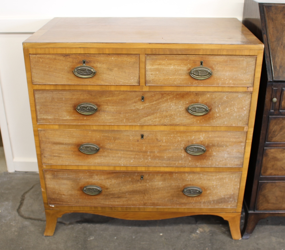 A George IV mahogany chest of drawers, the top with cross-banding and stringing,