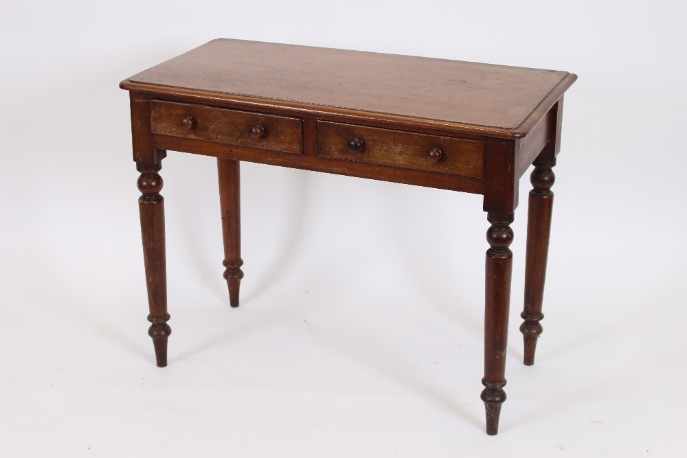 A Victorian mahogany side table, rectangular top with folded edge and rounded corners,