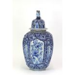 A Dutch Delft blue and white covered vase, probably 19th Century, lightly fluted shouldered form,