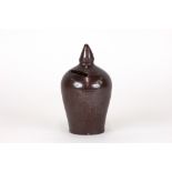 A Nottingham stoneware finial shape moneybox, 19th Century, with an incised band and pointed finial,