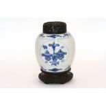 A Chinese blue and white ginger jar, probably 19th Century reverse painted with precious objects,