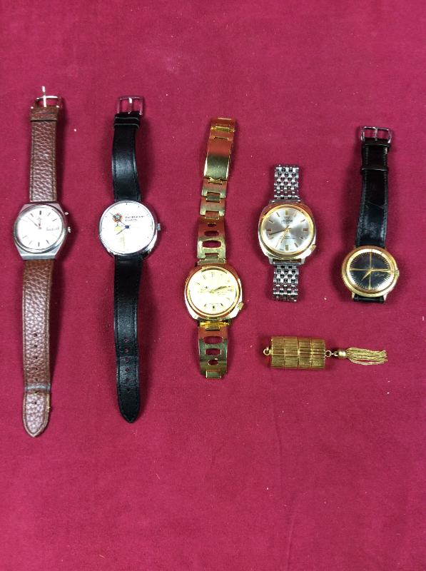 A box of various wrist watches