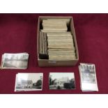 A box of various postcards