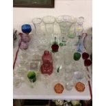 A quantity of various colours and other glassware to include vases; decanters; cranberry glass jugs;