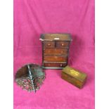 A Victorian mahogany miniature table top chest fitted two short over three long drawers;