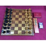 A Staunton patterned chess set (weighted) together with a chess board, a cribbage board,