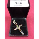 A sterling silver and multi gemstone set cross pendant