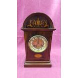 An Edwardian mahogany and inlaid two hole mantel clock