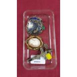 A silver and yellow pendant; a cameo brooch; a crucifix pendant etc.