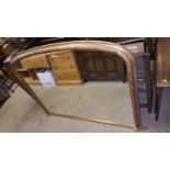 A large gilt framed overmantel mirror with leaf decoration