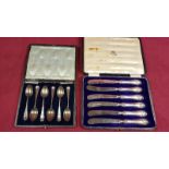 A cased set of six silver coffee spoons;