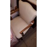 A 1930's leather upholstered elbow chair