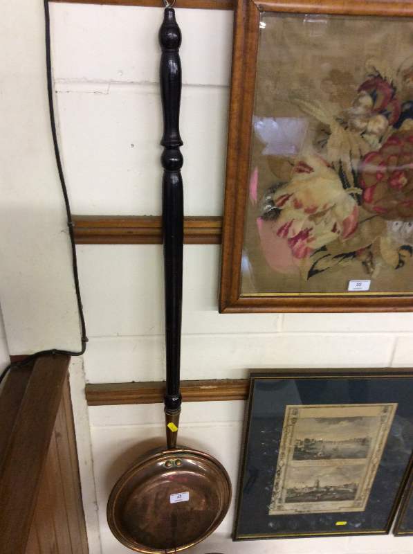 A Victorian copper warming pan