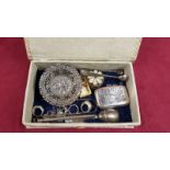 A box containing a silver pierced bonbon dish; various silver and white metal dress rings;