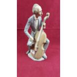 A Lladro figure in the form of a cellist (restored)