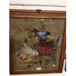 A maple framed Victorian woolwork embroidery of flower heads