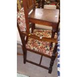 An oak and upholstered elbow chair