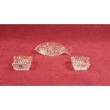 A pair of cut glass salts;