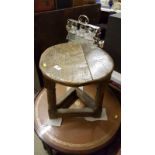 An antique oak joint stool with circular top