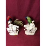 A Portuguese pottery parrot ornament; a pottery cockerel;