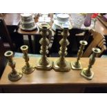 Three pairs of 19th Century brass candlesticks