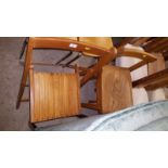 An elm top stool and a folding chair