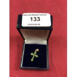 A 10ct gold emerald set cross pendant