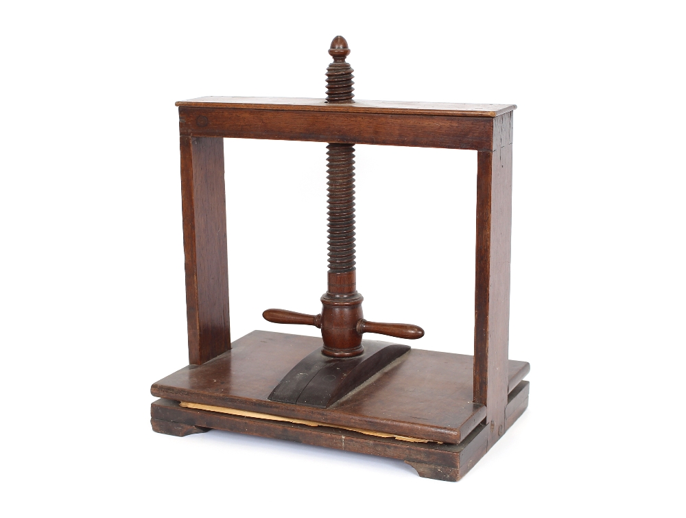 An antique elm screw action book press,