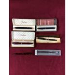 Four various Parker pens;