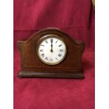 An Edwardian mahogany and inlaid mantel clock