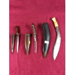 A Kukri knife together with two further knives