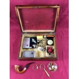 A Victorian rosewood box containing various badges; a silver mounted pipe;