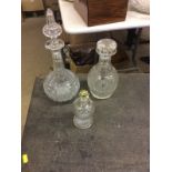 Two Victorian decanters and stoppers and one other glass bottle and stopper