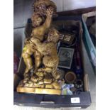 A box containing a large figure group and various ornaments etc.